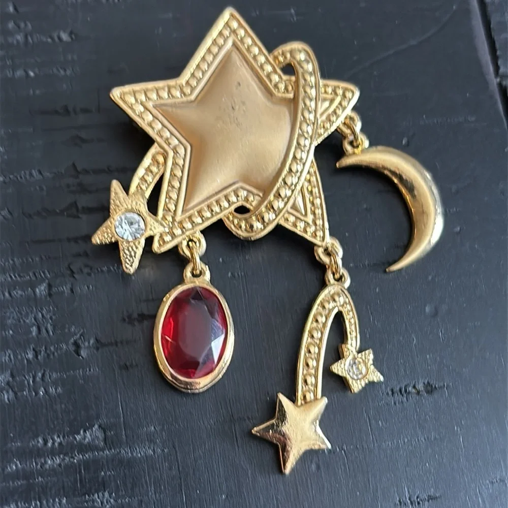 Gold Celestial Dangle Star and Moon Brooch with Red Gemstone​